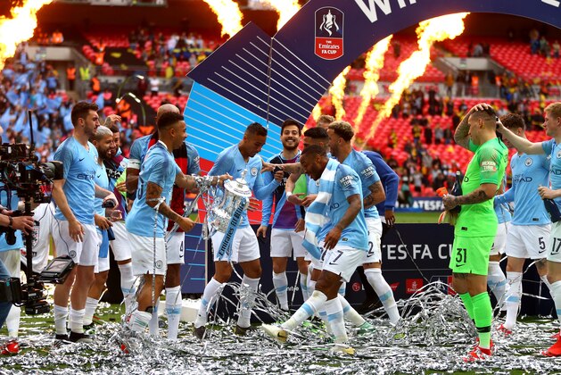 LONDON, ENGLAND - MAY 18: Gabriel Jesus and Raheem Sterling of Manchester City celebrate with the FA Cup after winning the Emirates FA Cup Final between Manchester City and Watford FC at Wembley Stadium on May 18, 2019 in London, England. (Photo by Chloe Knott - Danehouse/Getty Images)