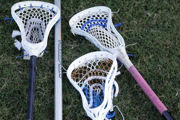 CHARLOTTE, NC - JULY 05:  Lacrosse sticks lie on the turf near the Charlotte Hounds bench just before a match against the Rochester Rattlers at American Legion Memorial Stadium on July 5, 2014 in Charlotte, North Carolina. Rochester won 15-13.  (Photo by Bob Leverone/Getty Images)