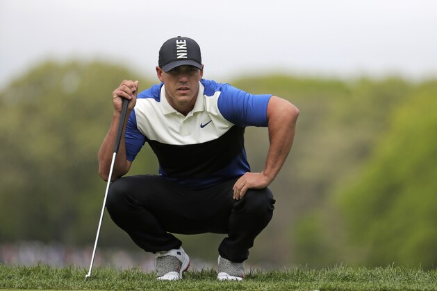 Brooks Koepka lines up a putt on the third green during the final round of the PGA Championship golf tournament, Sunday, May 19, 2019, at Bethpage Black in Farmingdale, N.Y. (AP Photo/Julio Cortez)