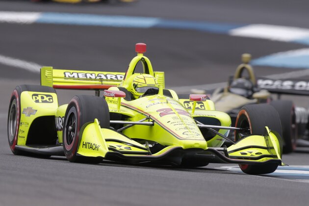 Simon Pagenaud, of France, drives through a turn on his way to winning the Indy GP IndyCar auto race at Indianapolis Motor Speedway, Saturday, May 11, 2019, in Indianapolis. (AP Photo/Michael Conroy)