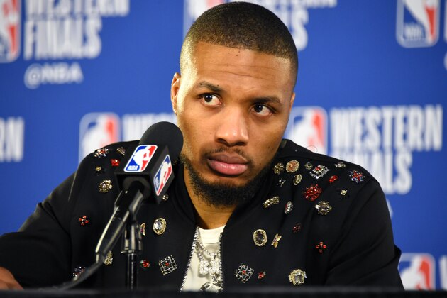 PORTLAND, OR - MAY 18: Damian Lillard #0 of the Portland Trail Blazers speaks to the media after Game Three of the Western Conference Finals against the Golden State Warriors on May 18, 2019 at the Moda Center in Portland, Oregon. NOTE TO USER: User expressly acknowledges and agrees that, by downloading and/or using this photograph, user is consenting to the terms and conditions of the Getty Images License Agreement. Mandatory Copyright Notice: Copyright 2019 NBAE (Photo by Andrew D. Bernstein/NBAE via Getty Images)