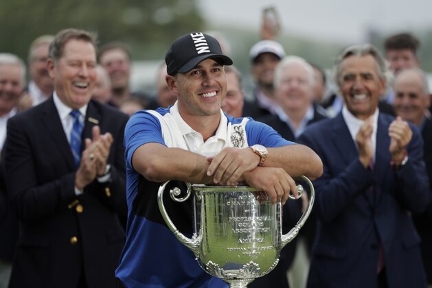 Brooks Koepka poses with the Wanamaker Trophy after winning the PGA Championship golf tournament, Sunday, May 19, 2019, at Bethpage Black in Farmingdale, N.Y. (AP Photo/Julio Cortez)