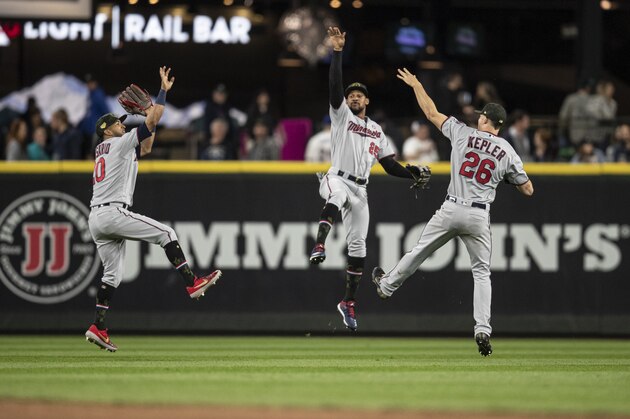 SEATTLE, WA - MAY 18: Outfielders Eddie Rosario #20 of the Minnesota Twins, Byron Buxton #25 and Max Kepler #26 celebrate after a game against the Seattle Mariners at T-Mobile Park on May 18, 2019 in Seattle, Washington. The Twins won 18-4. (Photo by Stephen Brashear/Getty Images)