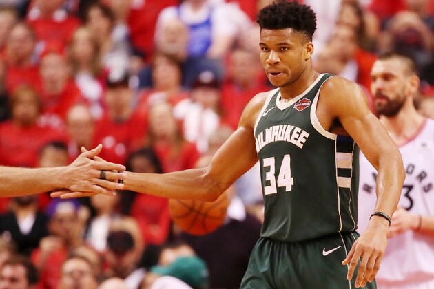 TORONTO, ONTARIO - MAY 19: Giannis Antetokounmpo #34 of the Milwaukee Bucks high fives Brook Lopez #11 during the second half in game three of the NBA Eastern Conference Finals against the Toronto Raptors at Scotiabank Arena on May 19, 2019 in Toronto, Canada. NOTE TO USER: User expressly acknowledges and agrees that, by downloading and or using this photograph, User is consenting to the terms and conditions of the Getty Images License Agreement. (Photo by Gregory Shamus/Getty Images)