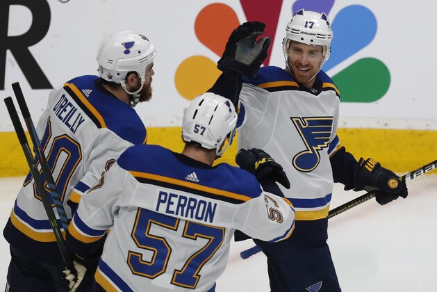 St. Louis Blues' Ryan O'Reilly (90), David Perron (57), celebrate with Jaden Schwartz (17), who scored a goal against the San Jose Sharks in the third period in Game 5 of the NHL hockey Stanley Cup Western Conference finals in San Jose, Calif., on Sunday, May 19, 2019. (AP Photo/Josie Lepe)