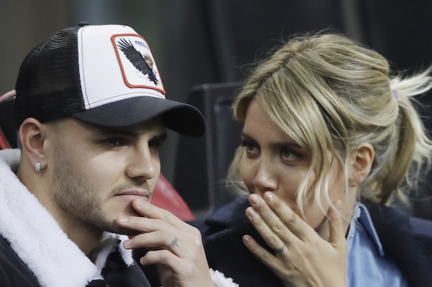 Inter Milan's Mauro Icardi is flanked by his wife Wanda Nara during the Europa League, round of 32, second leg soccer match between Inter Milan and SK Rapid Vienna, at the San Siro stadium in Milan, Italy, Thursday, Feb. 21, 2019. (AP Photo/Luca Bruno)