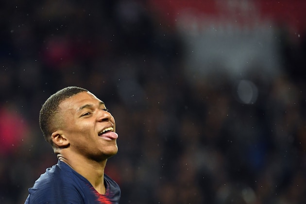 Paris Saint-Germain's French forward Kylian Mbappe celebrates after scoring a goal a goal during the French L1 football match between Paris Saint-Germain (PSG) and Dijon at the Parc des Princes stadium in Paris on May 18, 2019. (Photo by FRANCK FIFE / AFP)        (Photo credit should read FRANCK FIFE/AFP/Getty Images)
