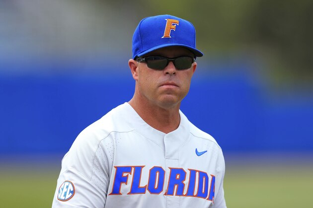 Florida head coach Kevin O'Sullivan walks to the dugout an NCAA Super Regional college baseball game against Auburn Sunday, June 10, 2018, in Gainesville, Fla. (AP Photo/Matt Stamey)