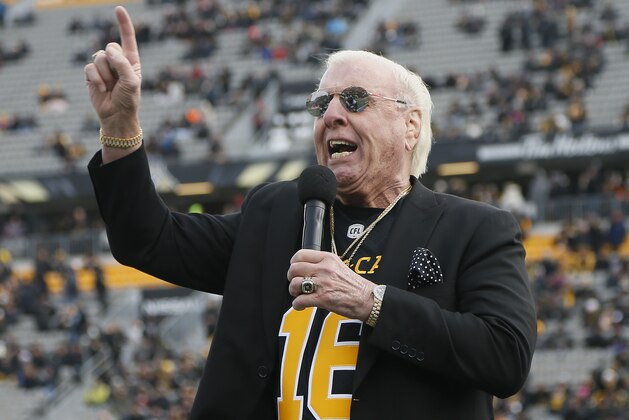 HAMILTON, ON - NOVEMBER 11: Former professional wrestler Ric Flair addresses the Hamilton Tiger-Cats fans prior to the start of the Eastern Semi-Final game against the BC Lions at Tim Hortons Field on November 11, 2018 in Hamilton, Ontario, Canada.  Hamilton defeated BC 48-8. (Photo by John E. Sokolowski/Getty Images)