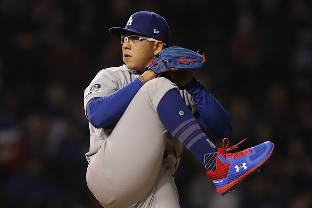 FILE - In this April 23, 2019, file photo, Los Angeles Dodgers' Julio Urias pitches against the Chicago Cubs during the first inning of a baseball game in Chicago. Los Angeles police say Urias was arrested Monday evening, May 13, 2019, for investigation of misdemeanor domestic battery. No details of the incident were released. (AP Photo/Jim Young,File)