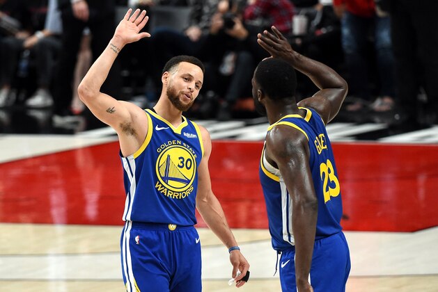 PORTLAND, OREGON - MAY 18: Stephen Curry #30 of the Golden State Warriors celebrates with Draymond Green #23 during the second half against the Portland Trail Blazers in game three of the NBA Western Conference Finals at Moda Center on May 18, 2019 in Portland, Oregon. NOTE TO USER: User expressly acknowledges and agrees that, by downloading and or using this photograph, User is consenting to the terms and conditions of the Getty Images License Agreement. (Photo by Steve Dykes/Getty Images)
