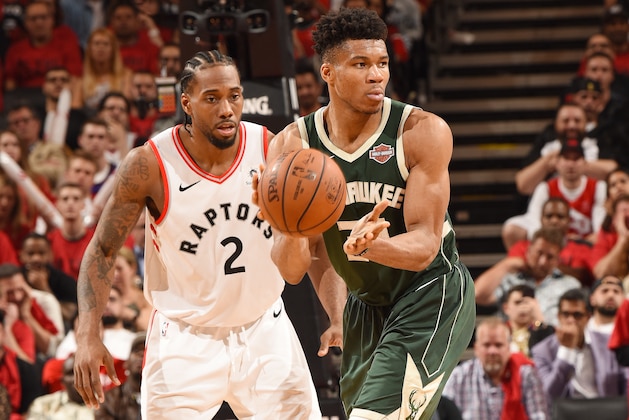 TORONTO, CANADA - MAY 19: Giannis Antetokounmpo #34 of the Milwaukee Bucks passes the ball during the game against Kawhi Leonard #2 of the Toronto Raptors during Game Three of the Eastern Conference Finals of the 2019 NBA Playoffs on May 19, 2019 at the Scotiabank Arena in Toronto, Ontario, Canada.  NOTE TO USER: User expressly acknowledges and agrees that, by downloading and or using this Photograph, user is consenting to the terms and conditions of the Getty Images License Agreement.  Mandatory Copyright Notice: Copyright 2019 NBAE (Photo by Ron Turenne/NBAE via Getty Images)