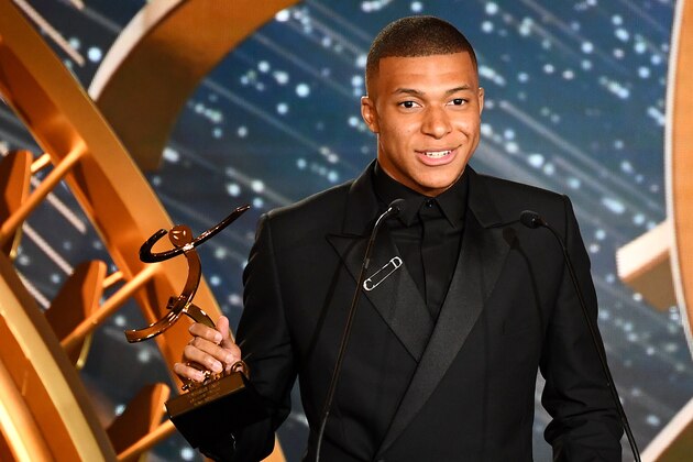 TOPSHOT - Paris Saint-Germain's French forward Kylian Mbappe delivers a speech after receiving the best hope player award, on May 19, 2019 in Paris, during the 28th edition of the UNFP (French National Professional Football players Union) trophy ceremony. (Photo by FRANCK FIFE / AFP)        (Photo credit should read FRANCK FIFE/AFP/Getty Images)