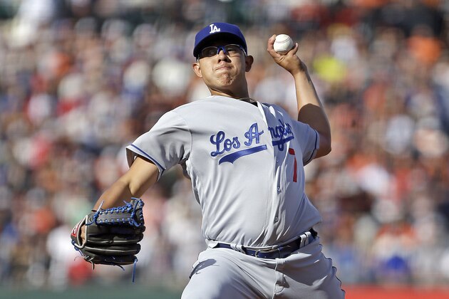 Los Angeles Dodgers pitcher Julio Urias works against the San Francisco Giants in the first inning of a baseball game Sunday, June 12, 2016, in San Francisco. (AP Photo/Ben Margot)