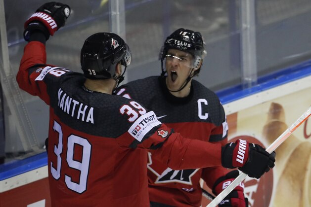 Canada's Kyle Turris, right, celebrates with Canada's Anthony Mantha, left, after scoring his sides second goal during the Ice Hockey World Championships group A match between Canada and the United States at the Steel Arena in Kosice, Slovakia, Tuesday, May 21, 2019. (AP Photo/Petr David Josek)