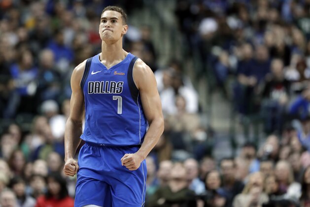 Dallas Mavericks forward Dwight Powell (7) celebrates sinking a basket against the Denver Nuggets during an NBA basketball game in Dallas, Friday, Feb. 22, 2019. (AP Photo/Tony Gutierrez)