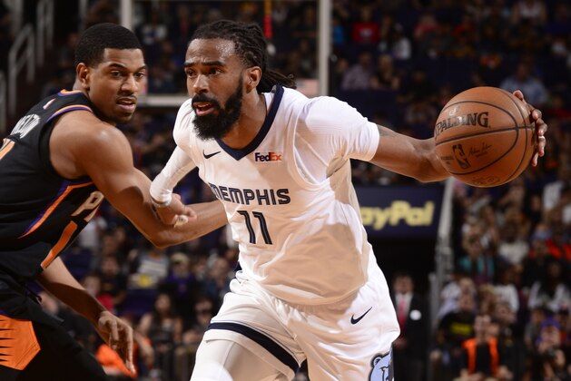 PHOENIX, AZ - MARCH 30: Mike Conley #11 of the Memphis Grizzlies drives to the basket against the Phoenix Suns on March 30, 2019 at Talking Stick Resort Arena in Phoenix, Arizona. NOTE TO USER: User expressly acknowledges and agrees that, by downloading and or using this photograph, user is consenting to the terms and conditions of the Getty Images License Agreement. Mandatory Copyright Notice: Copyright 2019 NBAE (Photo by Barry Gossage/NBAE via Getty Images)