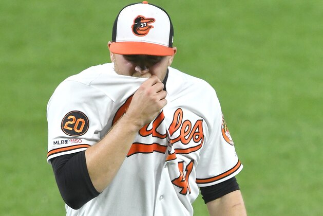 BALTIMORE, MD - MAY 07:  David Hess #41 of the Baltimore Orioles walks back to the dug out during a baseball game against the Boston Red Sox at Oriole Park at Camden Yards on May 7, 2019 in Baltimore. Maryland.  (Photo by Mitchell Layton/Getty Images)