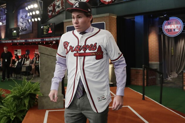 Carter Stewart, a pitcher from Eau Gallie High School in Florida, reacts after being selected eighth by the Atlanta Braves during the first round of the Major League Baseball draft Monday, June 4, 2018, in Secaucus, N.J. (AP Photo/Frank Franklin II)