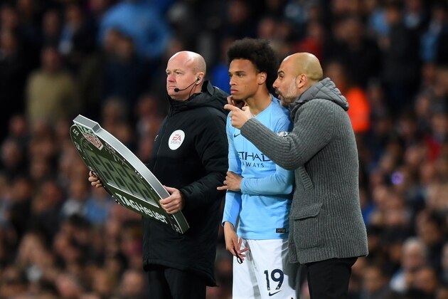 MANCHESTER, ENGLAND - MAY 06:  Josep Guardiola, Manager of Manchester City talks to subtitute Leroy Sane during the Premier League match between Manchester City and Leicester City at Etihad Stadium on May 06, 2019 in Manchester, United Kingdom. (Photo by Michael Regan/Getty Images)
