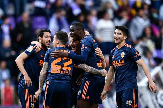 Valencia's players celebrate after winning the Spanish League football match between Real Valladolid and Valencia at the Jose Zorrilla stadium in Valladolid on May 18, 2019. (Photo by OSCAR DEL POZO / AFP)        (Photo credit should read OSCAR DEL POZO/AFP/Getty Images)