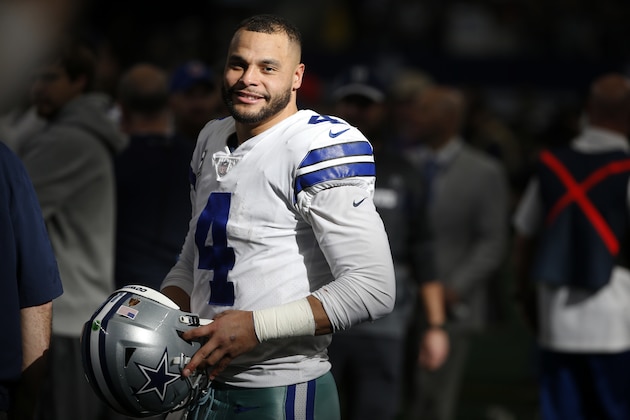 Dallas Cowboys quarterback Dak Prescott (4) stands on the sideline late in the second half of an NFL football game against the Tampa Bay Buccaneers in Arlington, Texas, Sunday, Dec. 23, 2018. (AP Photo/Ron Jenkins)