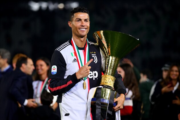 TURIN, ITALY - MAY 19: Cristiano Ronaldo of Juventus poses with the Serie A trophy following the Serie A match between Juventus and Atalanta BC at Allianz Stadium on May 19, 2019 in Turin, Italy. (Photo by Chris Brunskill/Fantasista/Getty Images)