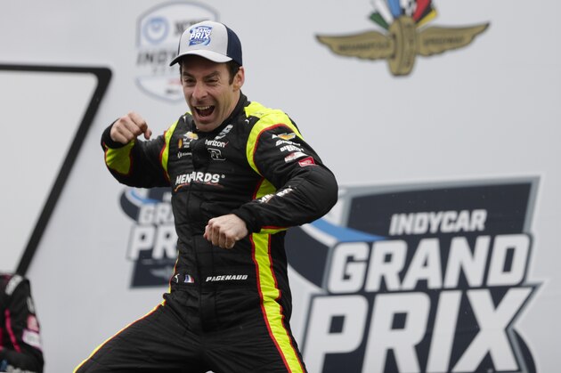 Simon Pagenaud, of France, celebrates after winning the Indy GP IndyCar auto race at Indianapolis Motor Speedway, Saturday, May 11, 2019, in Indianapolis. (AP Photo/Michael Conroy)