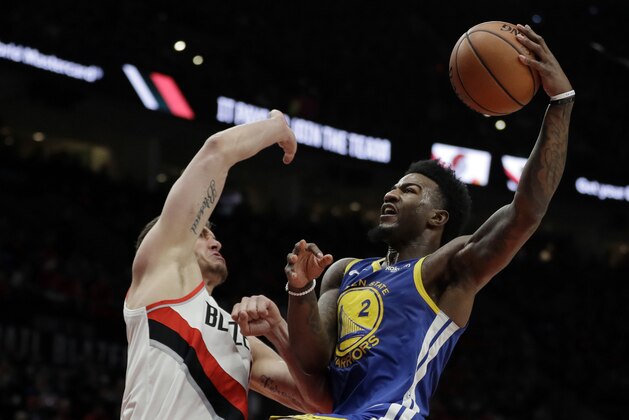 Golden State Warriors forward Jordan Bell (2) goes up to shoot against Portland Trail Blazers forward Meyers Leonard, left, during the first half of Game 4 of the NBA basketball playoffs Western Conference finals, Monday, May 20, 2019, in Portland, Ore. (AP Photo/Ted S. Warren)
