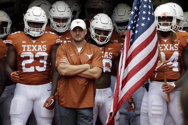 Texas head coach Tom Herman, with arms crossed, waits with his team to take the field for an NCAA college football game against TCU, Saturday, Sept. 22, 2018, in Austin, Texas. (AP Photo/Eric Gay)