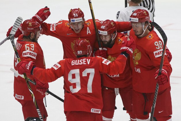 Russian players celebrate their side's second goal, scored by Russia's Mikhail Sergachyov, right, during the Ice Hockey World Championships quarterfinal match between Russia and the United States at the Steel Arena in Bratislava, Slovakia, Thursday, May 23, 2019. (AP Photo/Ronald Zak)