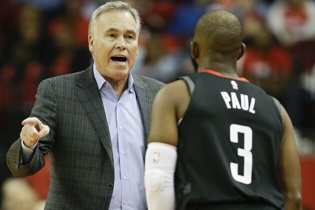 Houston Rockets head coach Mike D'Antoni, left, talks with guard Chris Paul during the first half of an NBA basketball game against the Utah Jazz, Monday, Dec. 17, 2018, in Houston. (AP Photo/Eric Christian Smith)