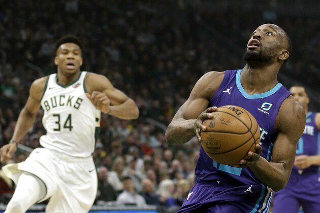 Charlotte Hornets' Kemba Walker looks to shoot past Milwaukee Bucks' Giannis Antetokounmpo (34) during the first half of an NBA basketball game Saturday, March 9, 2019, in Milwaukee. (AP Photo/Aaron Gash)