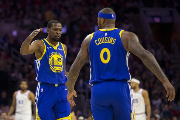 PHILADELPHIA, PA - MARCH 02: Kevin Durant #35 and DeMarcus Cousins #0 of the Golden State Warriors react against the Philadelphia 76ers at the Wells Fargo Center on March 2, 2019 in Philadelphia, Pennsylvania. The Warriors defeated the 76ers 120-117. NOTE TO USER: User expressly acknowledges and agrees that, by downloading and or using this photograph, User is consenting to the terms and conditions of the Getty Images License Agreement. (Photo by Mitchell Leff/Getty Images)