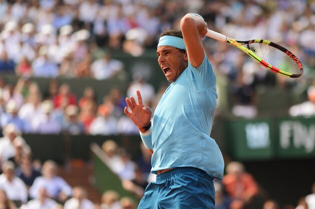 PARIS, FRANCE - JUNE 10: Rafael Nadal of Spain hits a forehand to Dominic Thiem of Austria in the final of the men's singles at Roland Garros during the French Open on June 10, 2018 in Paris, France. (Photo by Mike Frey/Getty Images) PARIS, FRANCE - JUNE 10: Rafael Nadal of Spain hits a forehand to Dominic Thiem of Austria in the final of the men's singles at Roland Garros during the French Open on June 10, 2018 in Paris, France. (Photo by Mike Frey/Getty Images)