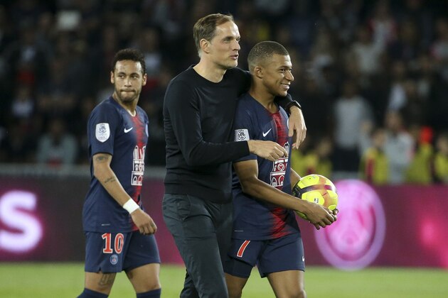 PARIS, FRANCE - APRIL 21: Coach of PSG Thomas Tuchel, Kylian Mbappe, Neymar Jr (left) celebrate the title of French Champion 2019 (Champion de France) following the French Ligue 1 match between Paris Saint-Germain (PSG) and AS Monaco (ASM) at Parc des Princes stadium on April 21, 2019 in Paris, France. (Photo by Jean Catuffe/Getty Images)