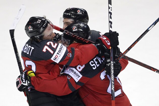 Canada's Damon Severson, right, celebrates after scoring his side's second goal during the Ice Hockey World Championships quarterfinal match between Canada and Switzerland at the Steel Arena in Kosice, Slovakia, Thursday, May 23, 2019. (AP Photo/Petr David Josek)