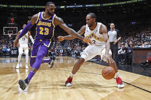 TORONTO, CANADA - MARCH 14: Kawhi Leonard #2 of the Toronto Raptors handles the ball against LeBron James #23 of the Los Angeles Lakers on March 14, 2019 at the Scotiabank Arena in Toronto, Ontario, Canada.  NOTE TO USER: User expressly acknowledges and agrees that, by downloading and or using this Photograph, user is consenting to the terms and conditions of the Getty Images License Agreement.  Mandatory Copyright Notice: Copyright 2019 NBAE (Photo by Mark Blinch/NBAE via Getty Images)