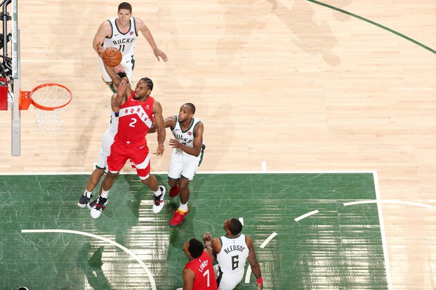 MILWAUKEE, WI - MAY 23: Kawhi Leonard #2 of the Toronto Raptors shoots the ball against the Milwaukee Bucks during Game Five of the Eastern Conference Finals of the 2019 NBA Playoffs on May 23, 2019 at the Fiserv Forum Center in Milwaukee, Wisconsin. NOTE TO USER: User expressly acknowledges and agrees that, by downloading and or using this Photograph, user is consenting to the terms and conditions of the Getty Images License Agreement. Mandatory Copyright Notice: Copyright 2019 NBAE (Photo by Nathaniel S. Butler/NBAE via Getty Images).