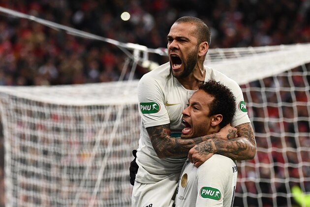 Paris Saint-Germain's Brazilian defender Dani Alves (L) celebrates with his teammate Brazilian forward Neymar after scoring a goal during the French Cup final football match between Rennes (SRFC) and Paris Saint-Germain (PSG), on April 27, 2019 at the Stade de France in Saint-Denis, outside Paris. (Photo by Anne-Christine POUJOULAT / AFP)        (Photo credit should read ANNE-CHRISTINE POUJOULAT/AFP/Getty Images)