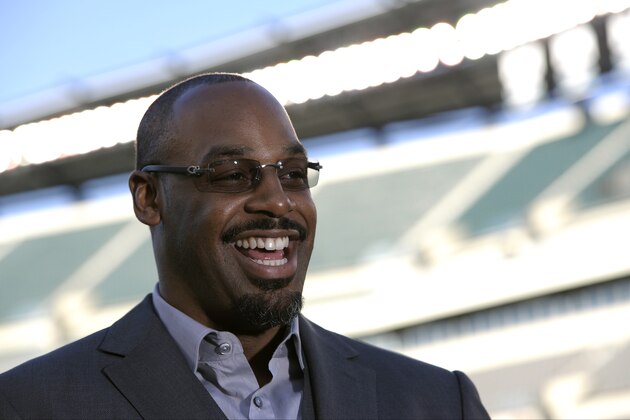 Former Philadelphia Eagles quarterback Donovan McNabb laughs during an interview before an NFL football game between the Philadelphia Eagles and the Kansas City Chiefs, Thursday, Sept. 19, 2013, in Philadelphia. McNabb is scheduled to have his jersey retired at halftime. (AP Photo/Michael Perez)