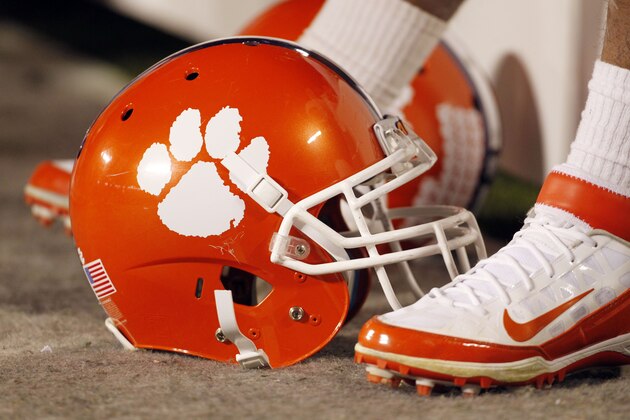 FILE - In this Dec. 3, 2011, file photo, a Clemson football helmet rests on the sidelines during the second half of an NCAA college football game against Virginia Tech in Charlotte, N.C. John Antonio, the man who designed Clemson's tiger paw logo, died Thursday, May 30, 2013, in Greenville, S.C., after a long battle with cancer, the university said. He was 83.  (AP Photo/Bob Leverone, File)