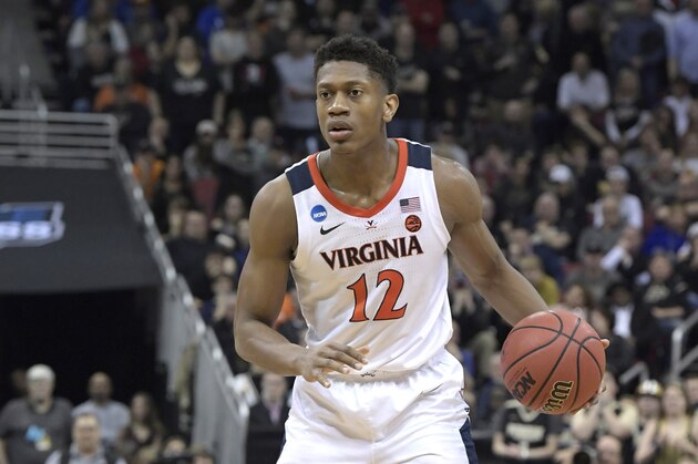 Virginia's De'Andre Hunter dribbles during the second half of the men's NCAA Tournament college basketball South Regional final game against Purdue, Saturday, March 30, 2019, in Louisville, Ky. (AP Photo/Timothy D. Easley)