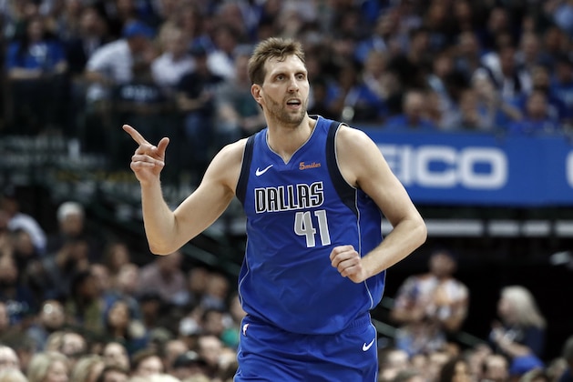 Dallas Mavericks' Dirk Nowitzki (41) celebrates a basket against the Phoenix Suns during the first half of an NBA basketball game in Dallas, Tuesday, April 9, 2019. (AP Photo/Tony Gutierrez)