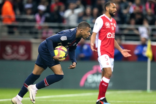Paris Saint-Germain's French forward Kylian MBappe reacts after scoring a goal during the French Ligue 1 football match between Reims (SDR) and Paris Saint-Germain (PSG) at the Auguste-Delaune stadium in Reims on May 24, 2019. (Photo by FRANCOIS NASCIMBENI / AFP)        (Photo credit should read FRANCOIS NASCIMBENI/AFP/Getty Images)