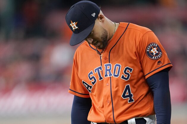 Houston Astros' George Springer leaves the field after being injured during the eighth inning of a baseball game against the Boston Red Sox Friday, May 24, 2019, in Houston. (AP Photo/David J. Phillip)