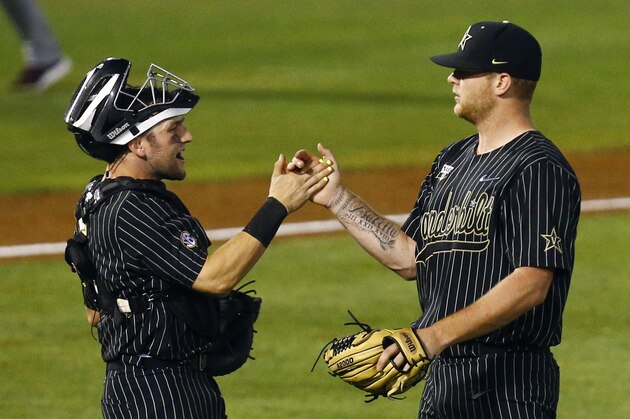 Vanderbilt catcher Phillip Clarke, left, congratulates pitcher Tyler Brown (21) after Vanderbilt defeated Mississippi State 1-0 in a Southeastern Conference tournament NCAA college baseball game Thursday, May 23, 2019, in Hoover, Ala. (AP Photo/Butch Dill)