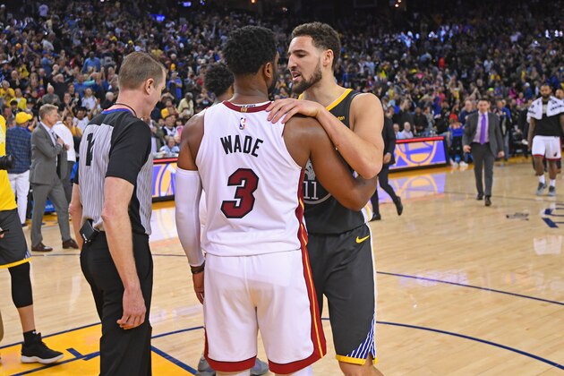 OAKLAND, CA - FEBRUARY 10:  Dwyane Wade #3 of the Miami Heat and Klay Thompson #11 of the Golden State Warriors hug after the game on February 10 at ORACLE Arena in Oakland, California. NOTE TO USER: User expressly acknowledges and agrees that, by downloading and or using this photograph, user is consenting to the terms and conditions of Getty Images License Agreement. Mandatory Copyright Notice: Copyright 2019 NBAE (Photo by Noah Graham/NBAE via Getty Images)