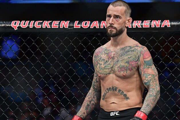 CM Punk stands in his corner before a welterweight bout at UFC 203 on Saturday, Sept. 10, 2016, in Cleveland. Mickey Gall won via submission. (AP Photo/David Dermer)