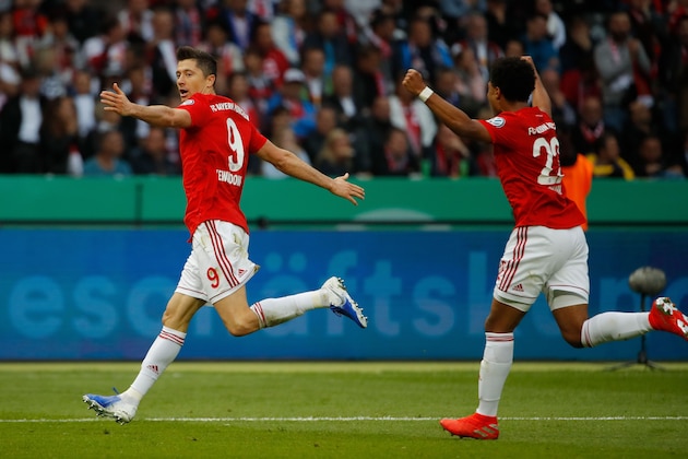 Bayern Munich's Polish forward Robert Lewandowski (L) celebrates scoring the opening goal with his teammate Austrian defender David Alaba during the German Cup (DFB Pokal) Final football match RB Leipzig v FC Bayern Munich at the Olympic Stadium in Berlin on May 25, 2019. (Photo by Odd ANDERSEN / AFP) / DFB REGULATIONS PROHIBIT ANY USE OF PHOTOGRAPHS AS IMAGE SEQUENCES AND QUASI-VIDEO.        (Photo credit should read ODD ANDERSEN/AFP/Getty Images)
